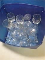 Blue crate of many clear wine stems