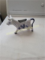 Blue and off white cow creamer
