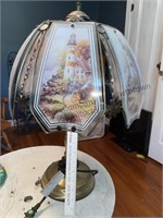 Decorative lamp with pictures of light houses on