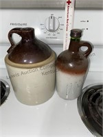 Crock jug with crack and Glass bottle