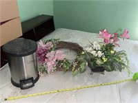 Small trashcan, wreath and flower arrangement