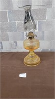 antique oil lamp (orange colour to it)