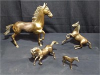 Group of brass horses, various sizes