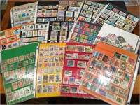 Large collection of vintage stamps in pages