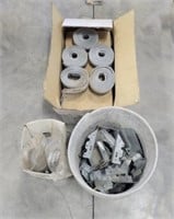 Box of coil nails, joist hangers, plywood clips