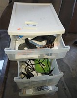 Plastic storage tote and contents on wheels