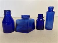 4 Small Blue Bottles