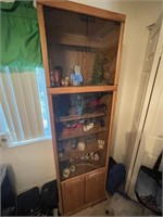 glass and wooden curio cabinet with contents