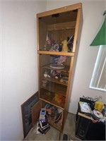 glass and wooden curio cabinet with contents
