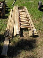 PILE OF LUMBER & WOOD LADDER