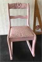 Child’s pink rocking chair