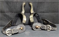 Pair of Spurs with hand-tooled leather straps