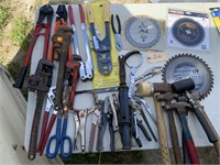 Pipe wrenches, saw blades, hammers