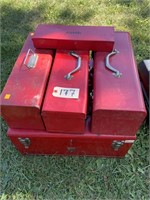 5 red metal tool boxes