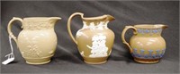 Three Georgian Spode brown stoneware jugs