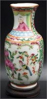 Cantonese famille rose vase on a timber stand