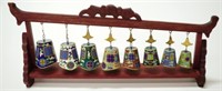 Set eight Chinese enamel bells in wood frame