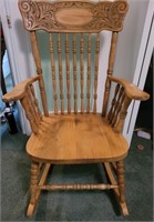 Pressed back rocking chair. Seat is 15".