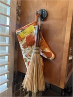 Pot holder and decorative broom