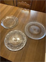 2 round glass trays and one plastic tray