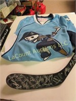 Signed hockey stick and a jersey
