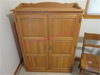 Nice Oak 2-dr storage cabinet (in office)