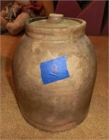 unglazed stoneware jar & a lid w/chip on knob