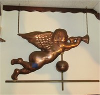 copper angel playing trumpet weather vane