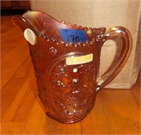 Marigold Carnival glass water pitcher