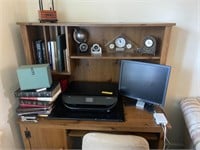 Computer, monitor, printer, books, and clocks