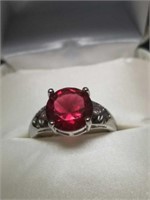 Red round jeweled ring