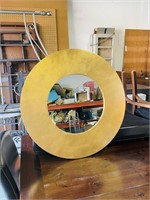 27" round gold color wood framed mirror