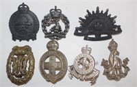 Seven various Army hat badges