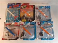 f8) six diecast airplanes. New in the package.