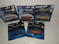 f8) five diecast toy trains. New in package. All