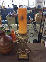 Ginger aromatherapy candle on fancy pillar holder