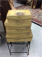 Set of four stacking decorative boxes