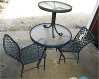 Lot #3446 - Glass top patio table with two