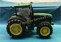 Plastic John Deere Toy tractor has lights and