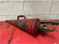 Wall mounted conical fire extinguisher.