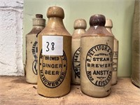 Five Antique earthenware bottles.