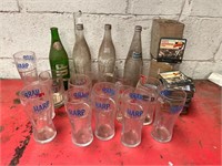 Vintage mineral bottles, glasses, and beer mats.