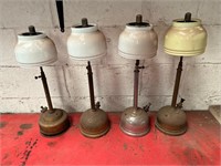 Four Antique Tilley lamps.