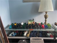 Large Assortment of Avon Collectables plus Display
