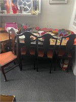 Dining Room Table with Four Chairs and Dishes