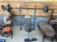 Golds gym weight bench with 150 pounds of weights