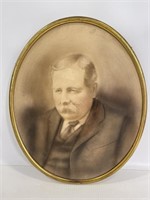 Brass framed portrait mustachioed man