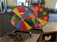 TWO COUNTER TOP PRIZE WHEELS WITH LARGE CARRYING .