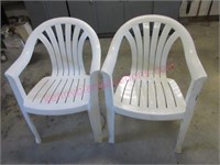 (2) White plastic stack chairs (garage)