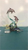 3 glass dolphin statues